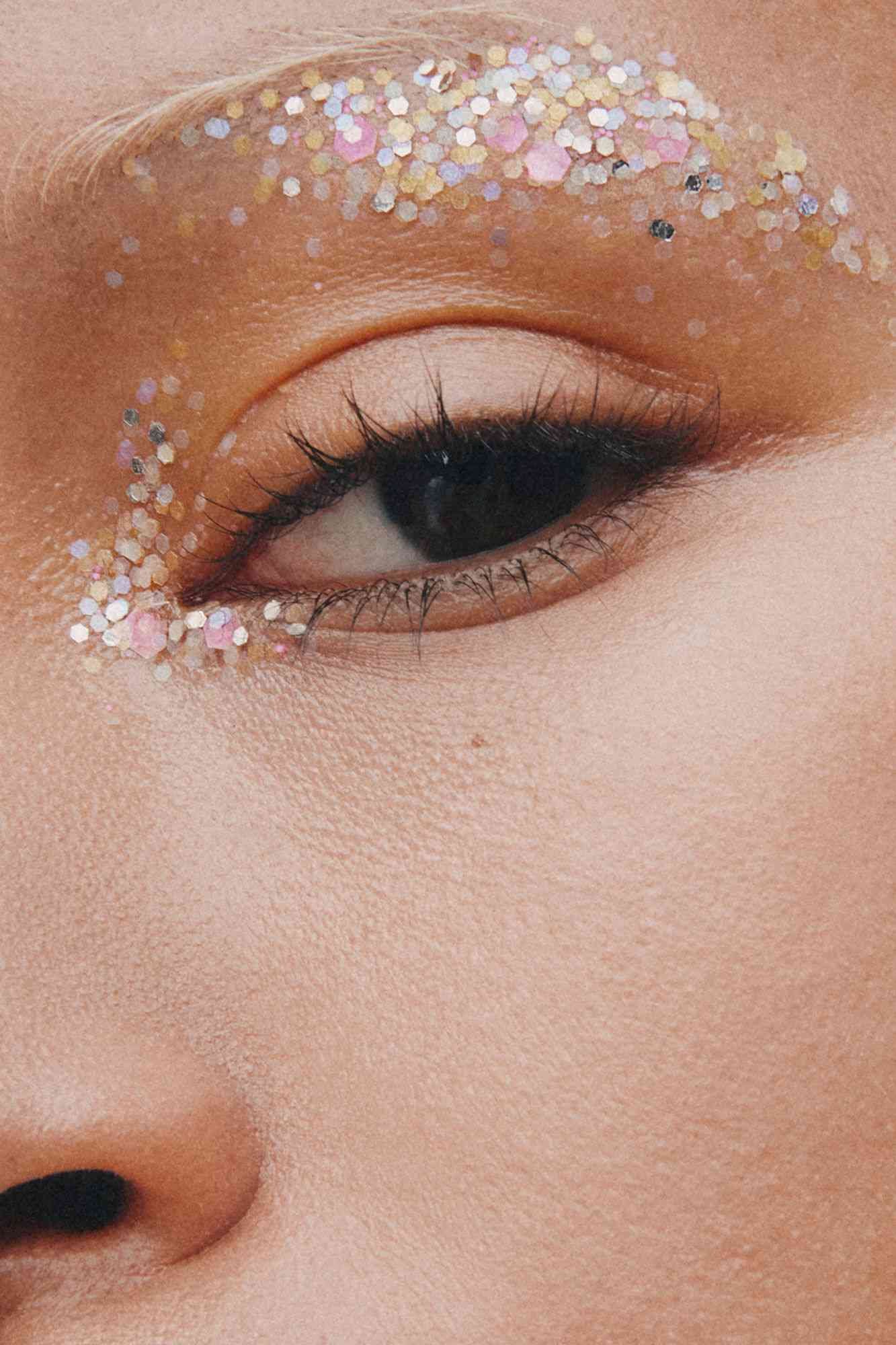 A close-up shot of Ganni glitter applied to an eyelid. 