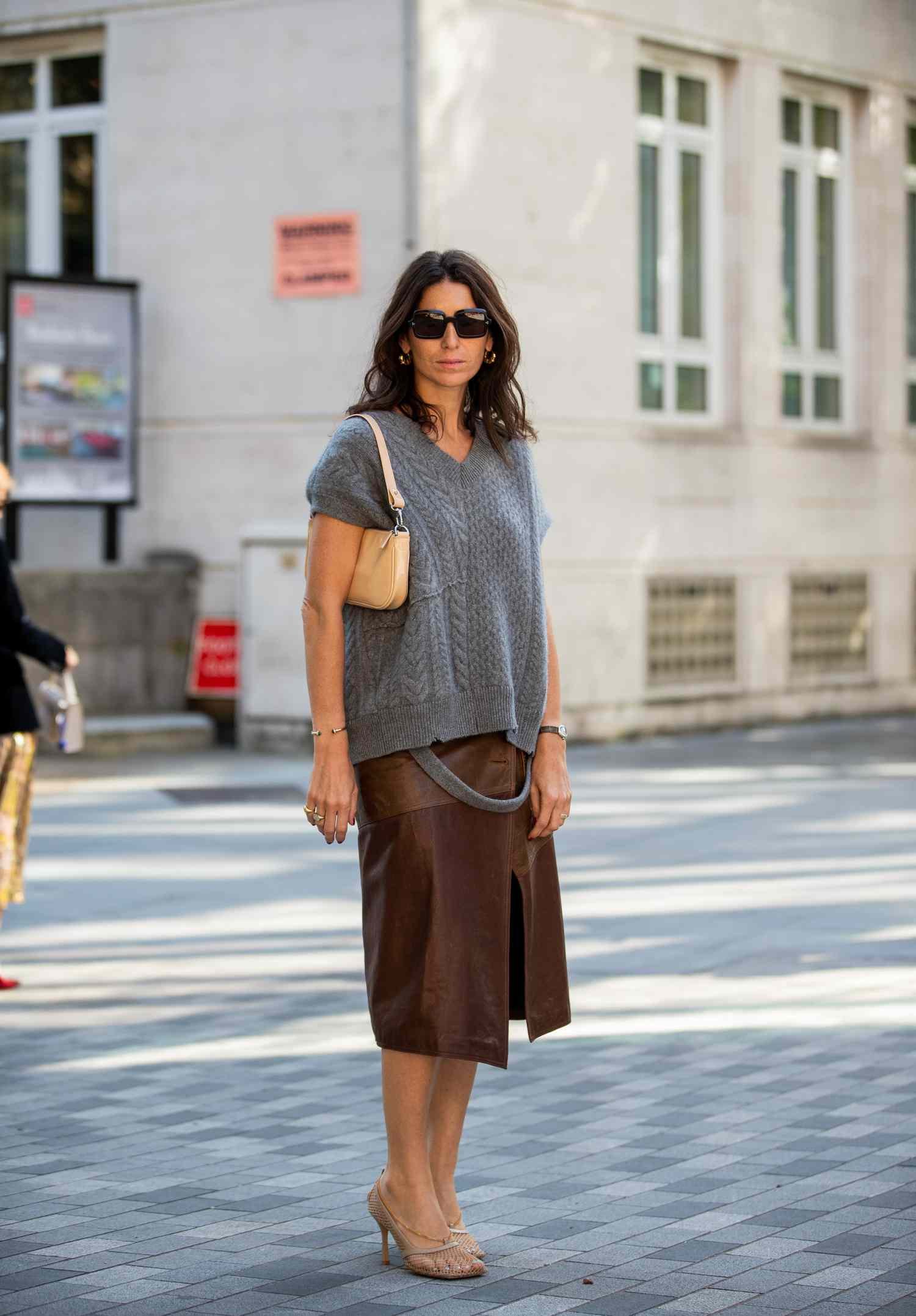 Person wearing A gray knit with A brown midi skirt with slit