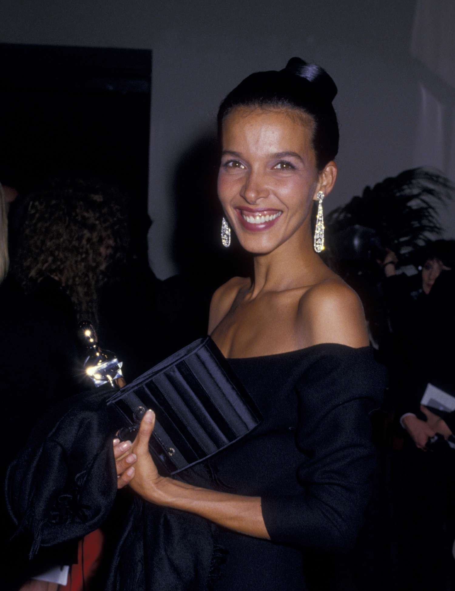 Woman in blackness evening gown with diamond earrings