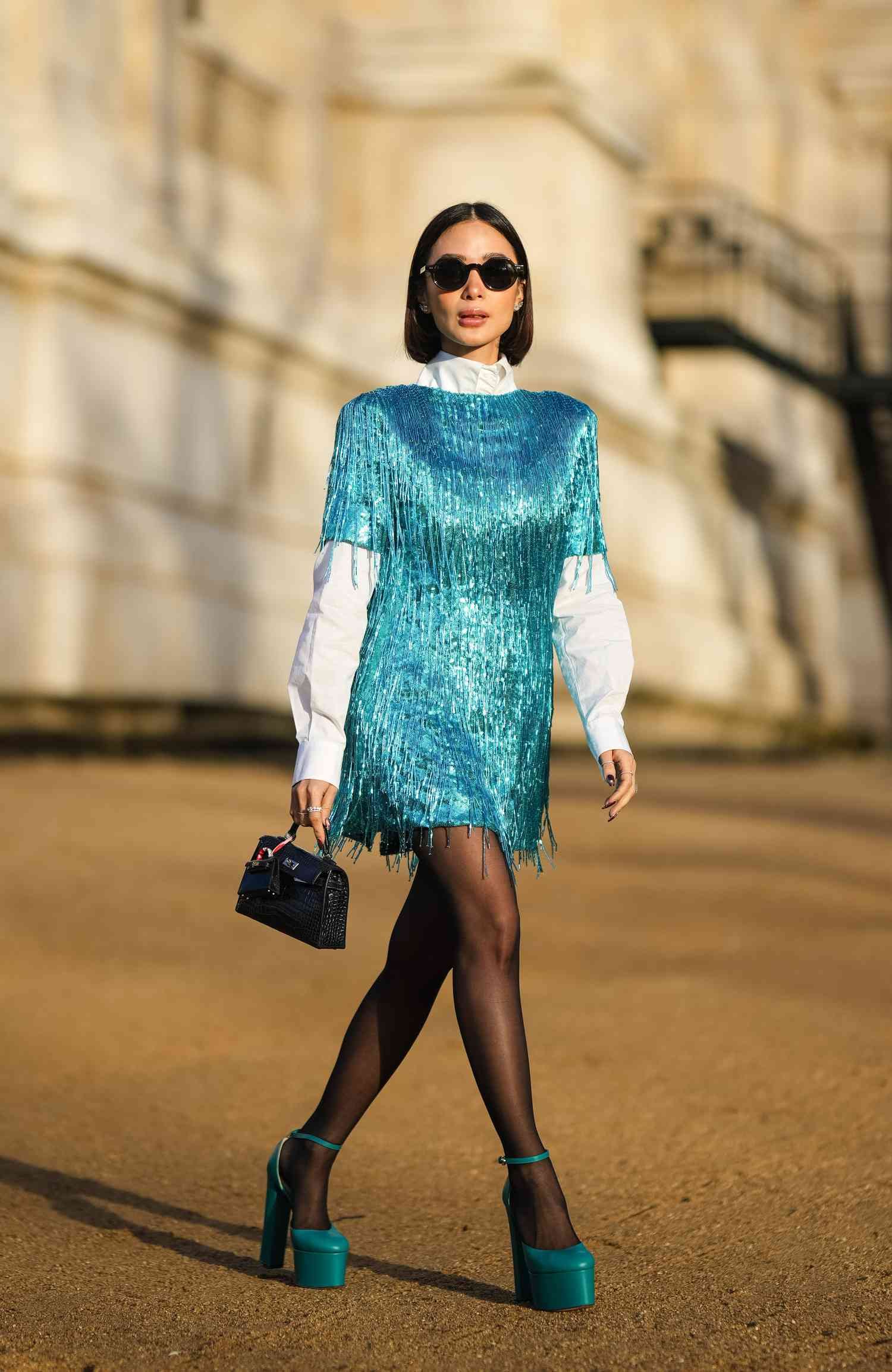 Heart Evangelista wears angstrom bead fringe mini dress, a capital of France mode Week street way look you tin can actually wear inch 2024.