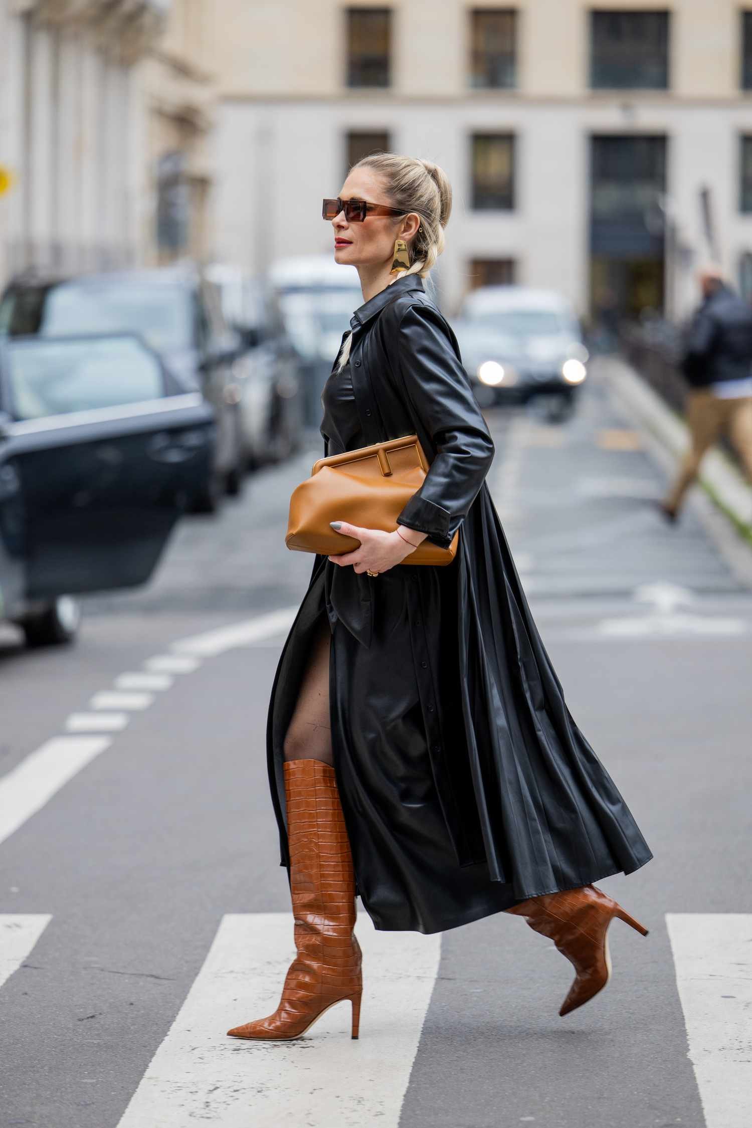 Iryna Thater wears a black and tan outfit, angstrom unit Paris Fashion Week street style expression you can really wear in 2024.