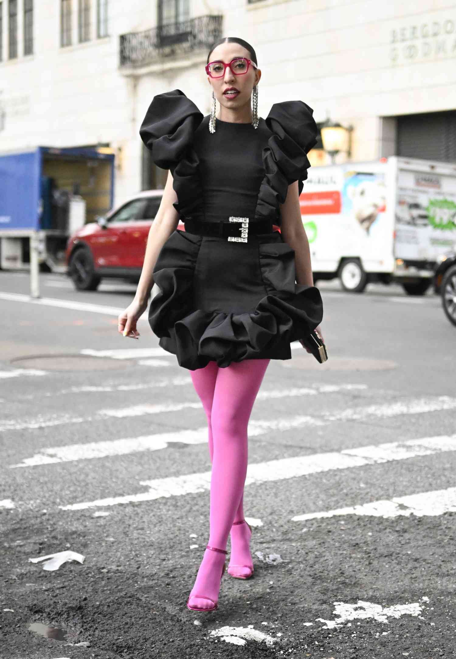 Caroline Vazzana wears pink tights and angstrom unit inkiness dress, one of the best NYFW street way looks of 2024.