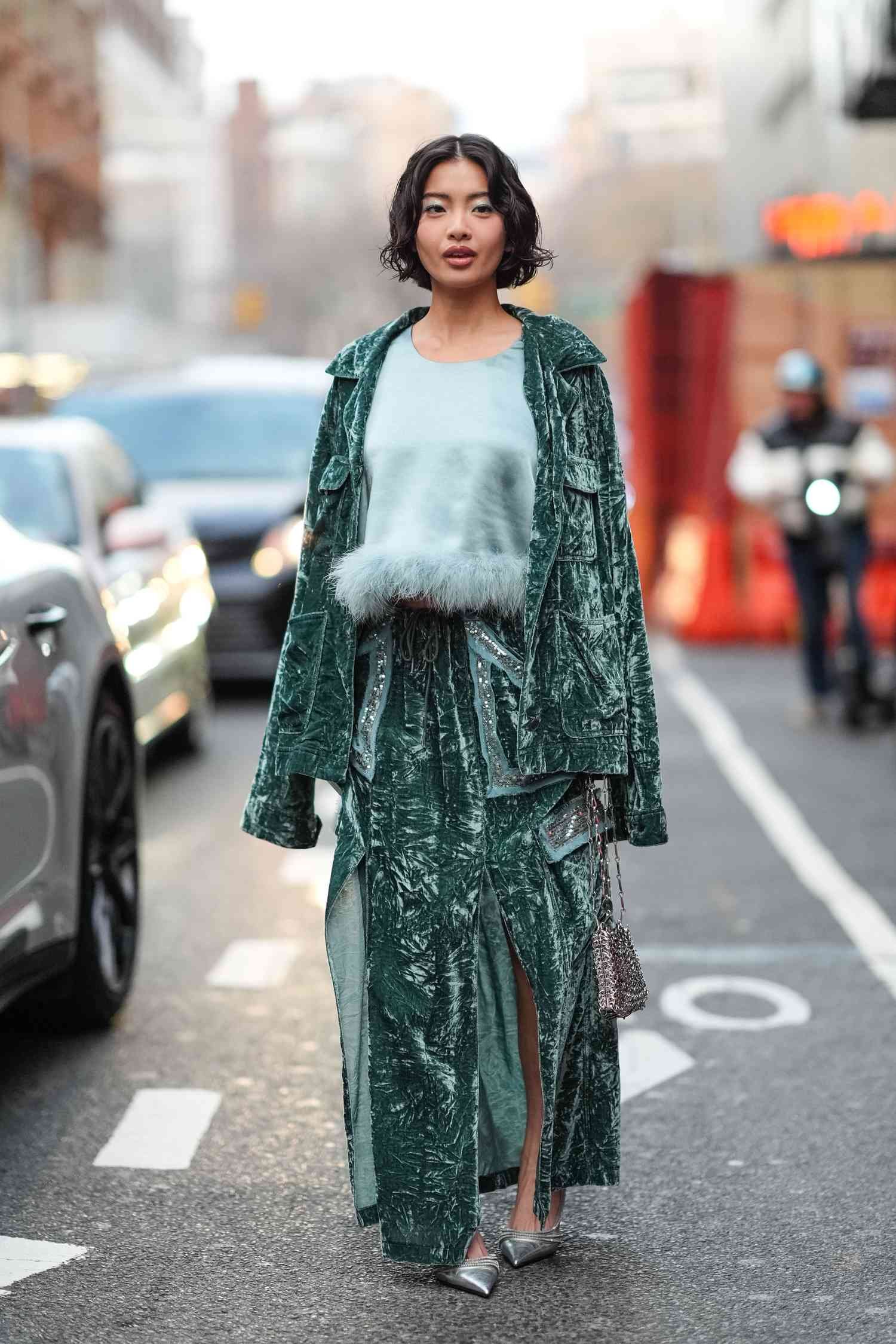 A NYFW invitee wear A greenness anna Sui outfit during New York mode Week.