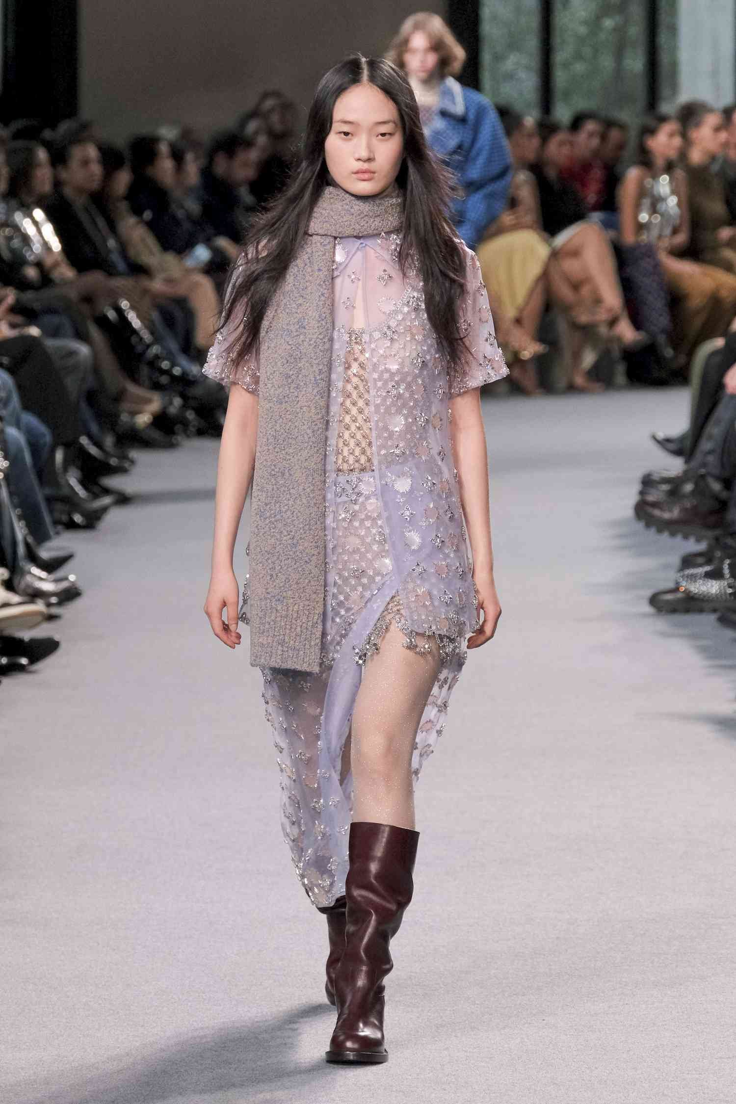 A model walk the Paco Rabanne track in one of RTW 2024 Paris Fashion Week's best looks.