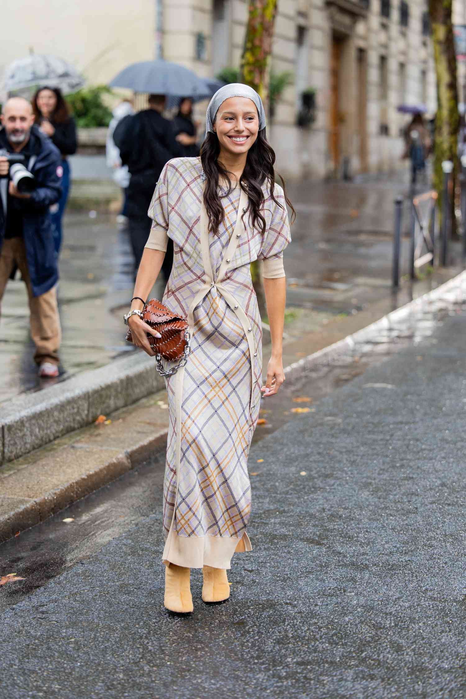 woman wears sweater dress