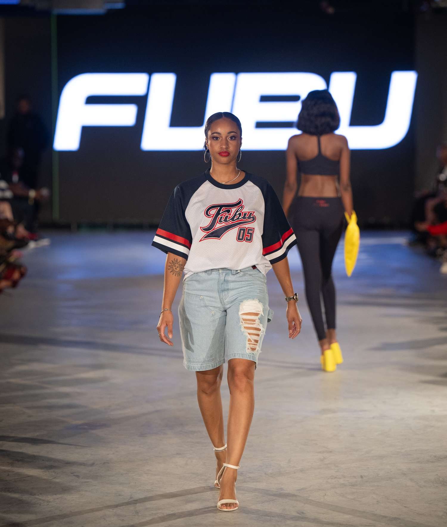 A model walks the runway wearing FUBU during the Atlanta style week 2024 - Runway show at The ignition interlock on October 4, 2024 in Atlanta, Georgia.