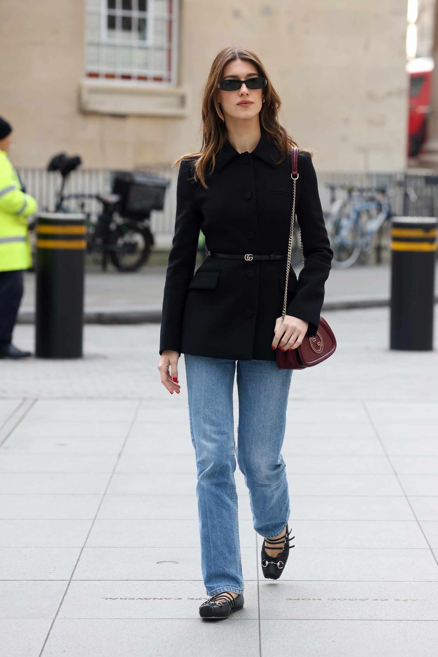 Daisy Edgar Mary Harris Jones wear black jacket, jeans, and concert dance flats. 