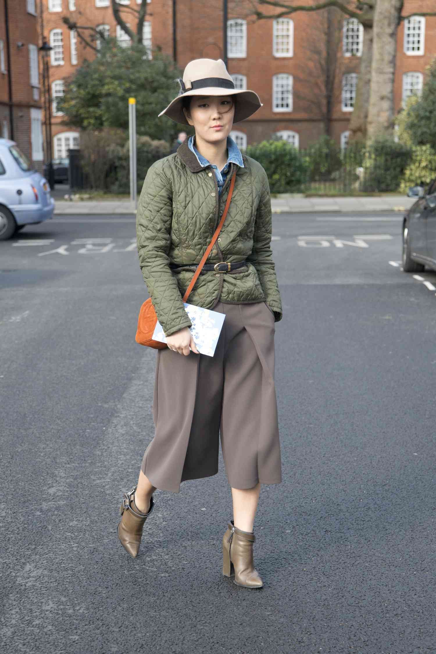 woman wear green jacket and brown pants