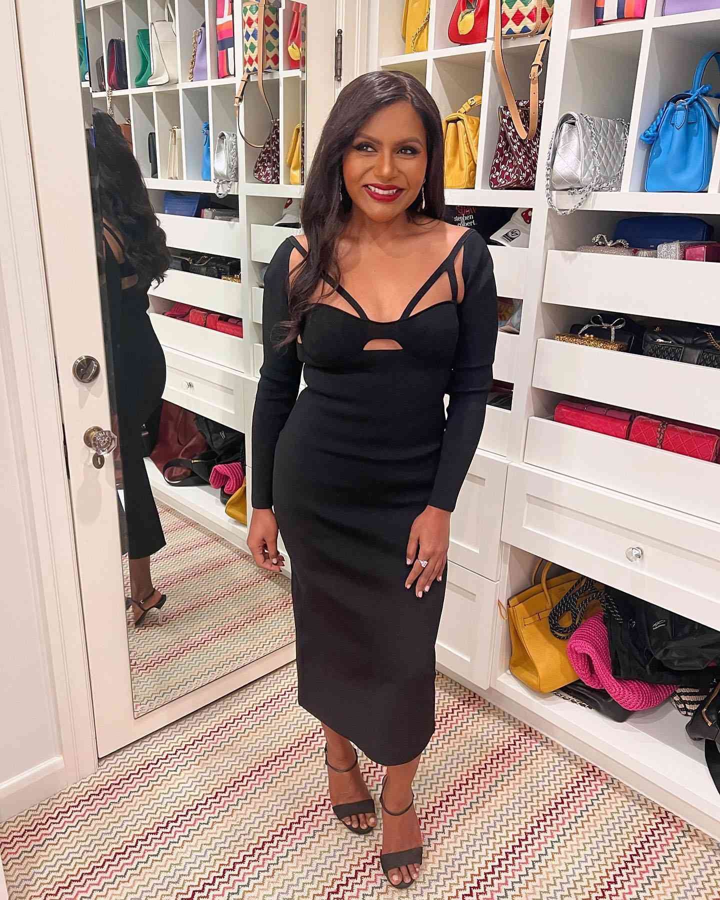 Mindy Kaling wearing away angstrom blackness Khaite frock with cutouts